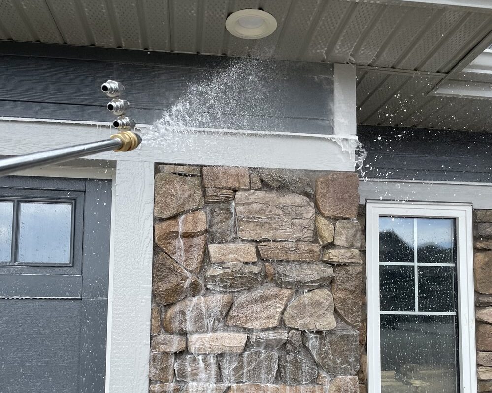 Image of water and soap covering home siding.